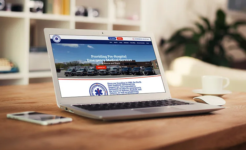 Ambulance service website displayed on a laptop